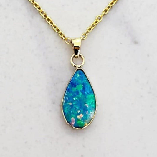 “Teardrop of Light” - Blue-Green Opal Pendant in 9-Carat Gold