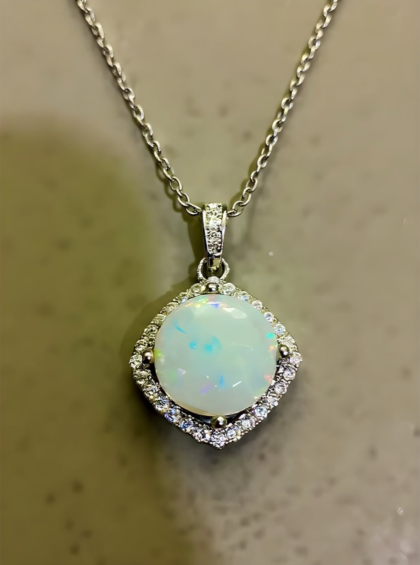 “Ethereal Light” - Round Opal Framed with Cubic Zirconia